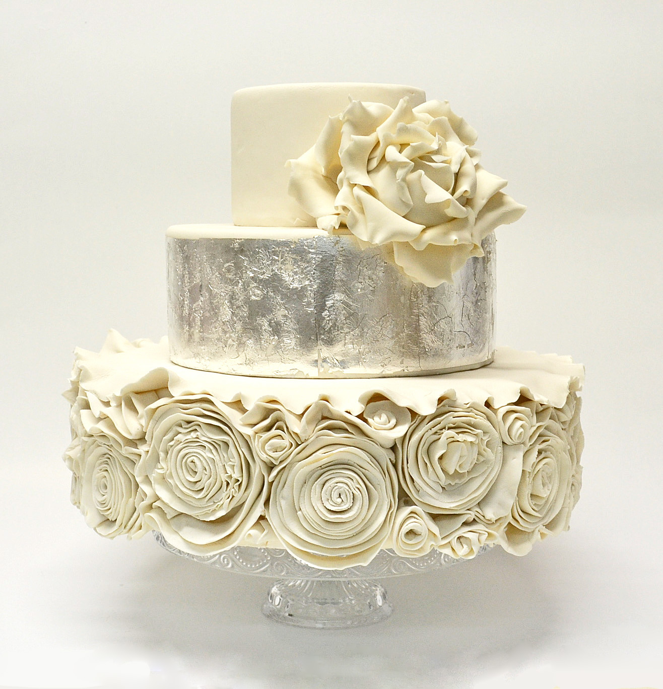 VERY ORNATE WHITE WEDDING CAKE WITH SILVER LEAF