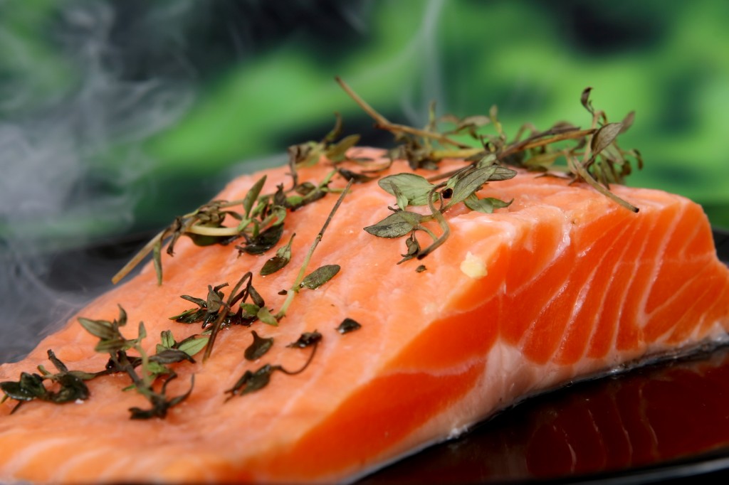 Summer food, rose colored fish steak in a wine marinade