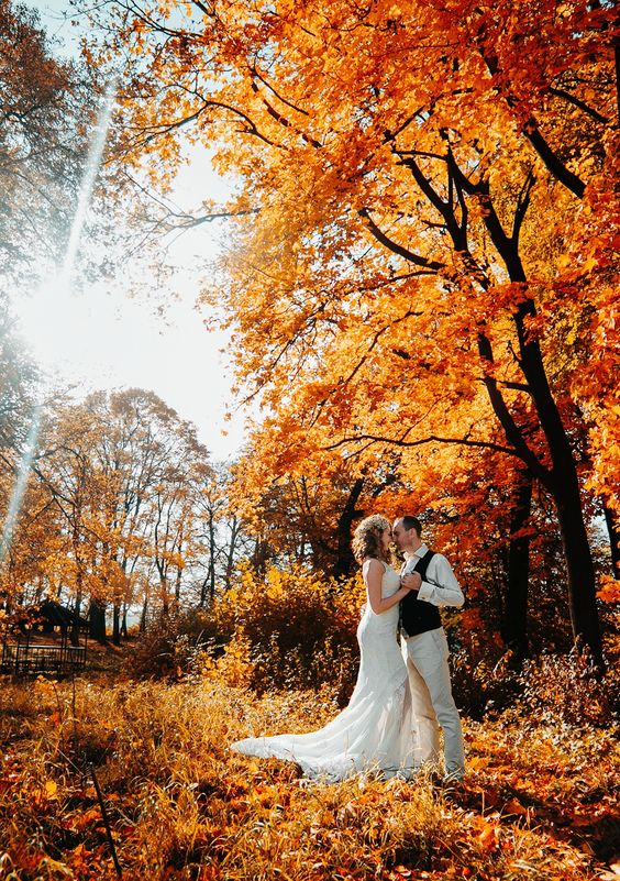 beautiful couple walking in the autumn lawn