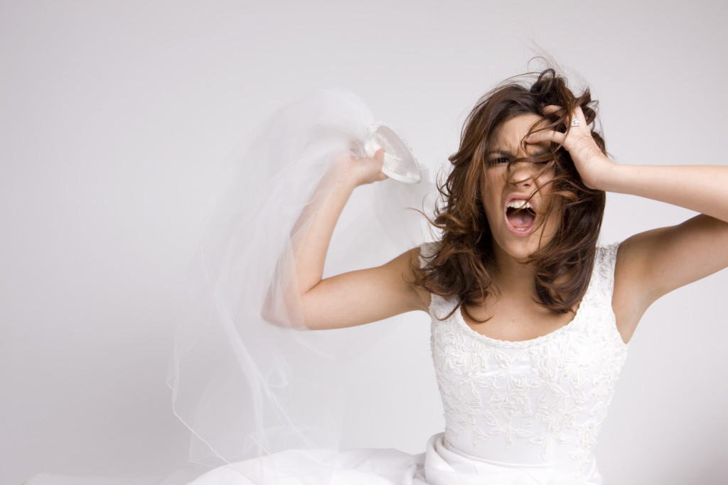 Angry Screaming Bride Throwing Veil on White, Copy Space