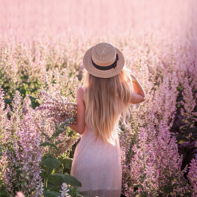 Young,Blonde,Woman,In,Straw,Hat,Looks,Into,The,Distance